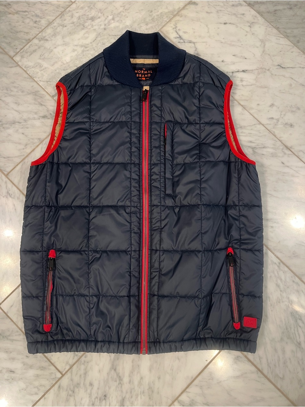 The Normal Brand Navy Quilted Puffer Vest with Red Trim